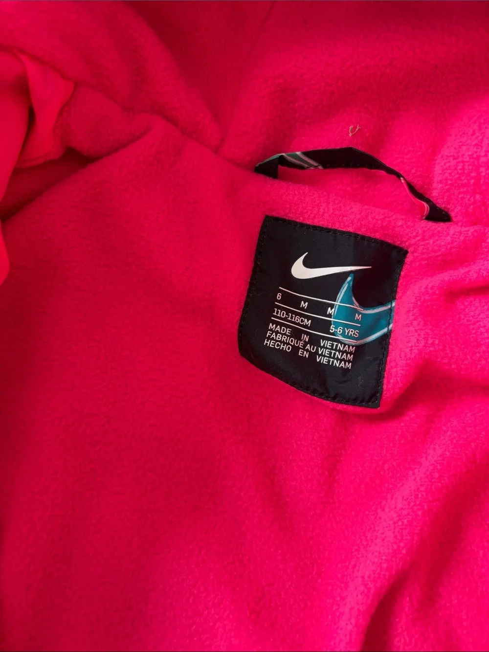 Nike Black Puffer Jacket with Multicolor Swooshes and Hot Pink Lining